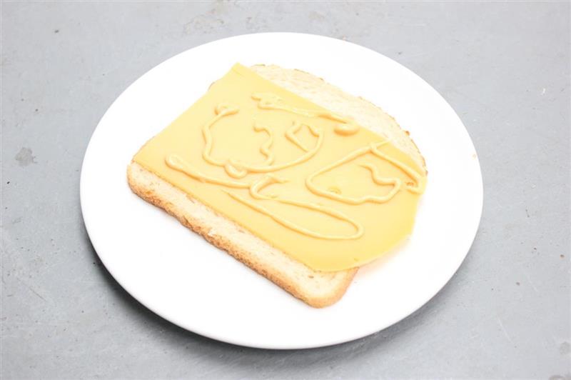 Painting on cheese on light brown bread, 2013